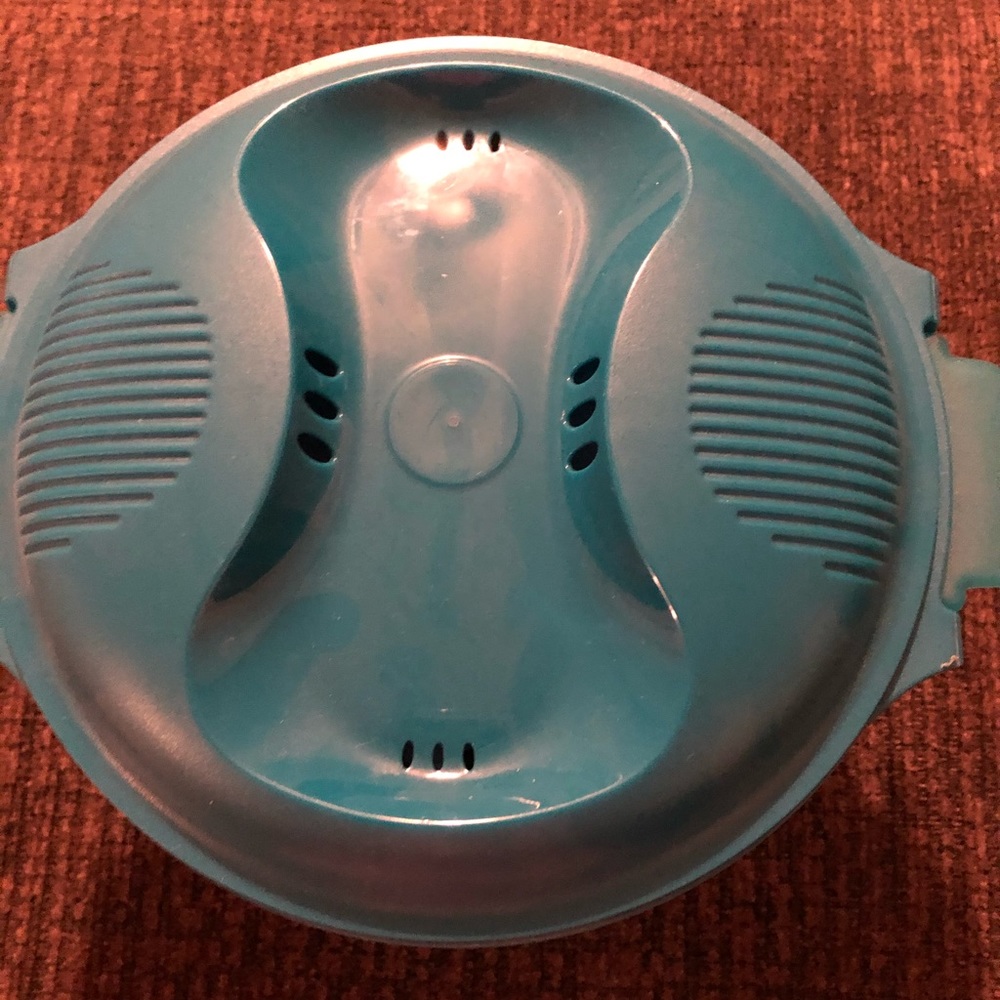 Tupperware rice cooker. New. With papers